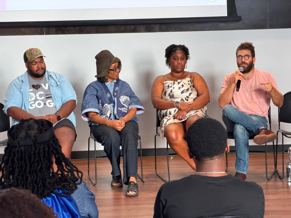 Panelists discuss education and community wealth at an AJE community conversation.